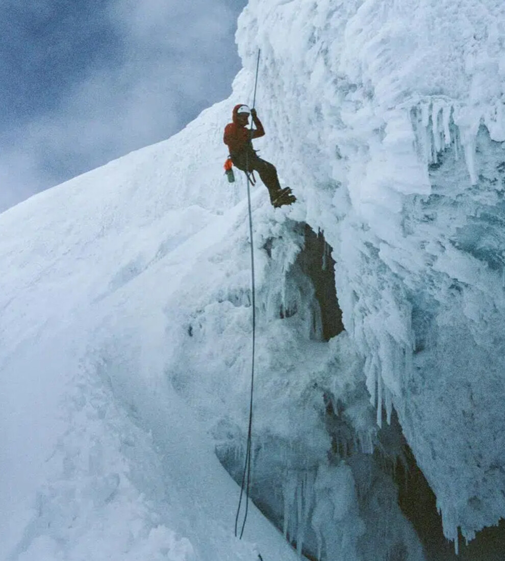 A climber hanging from a rope